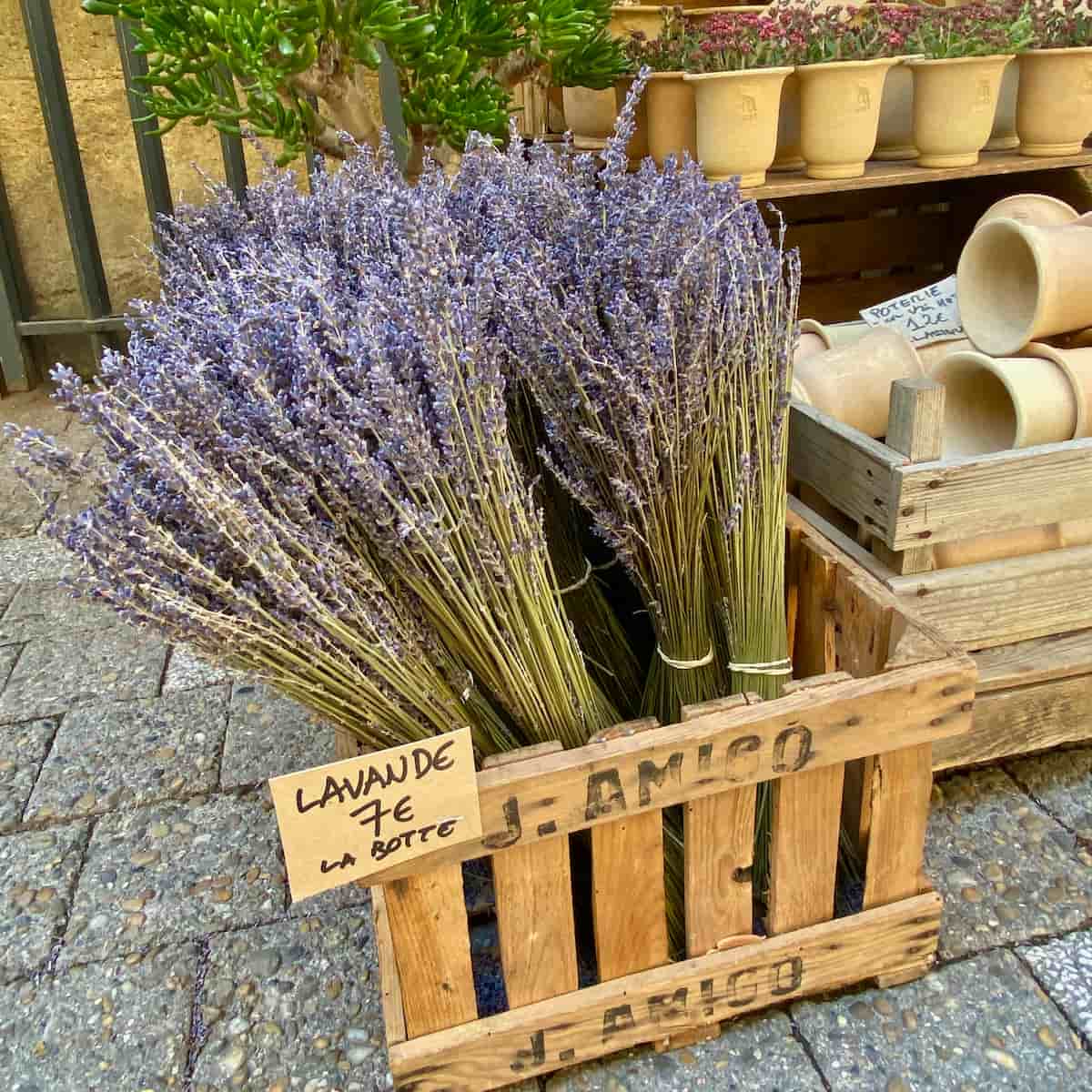 lavender-flowers wooden crate of bunches of dried purple lavender flowers