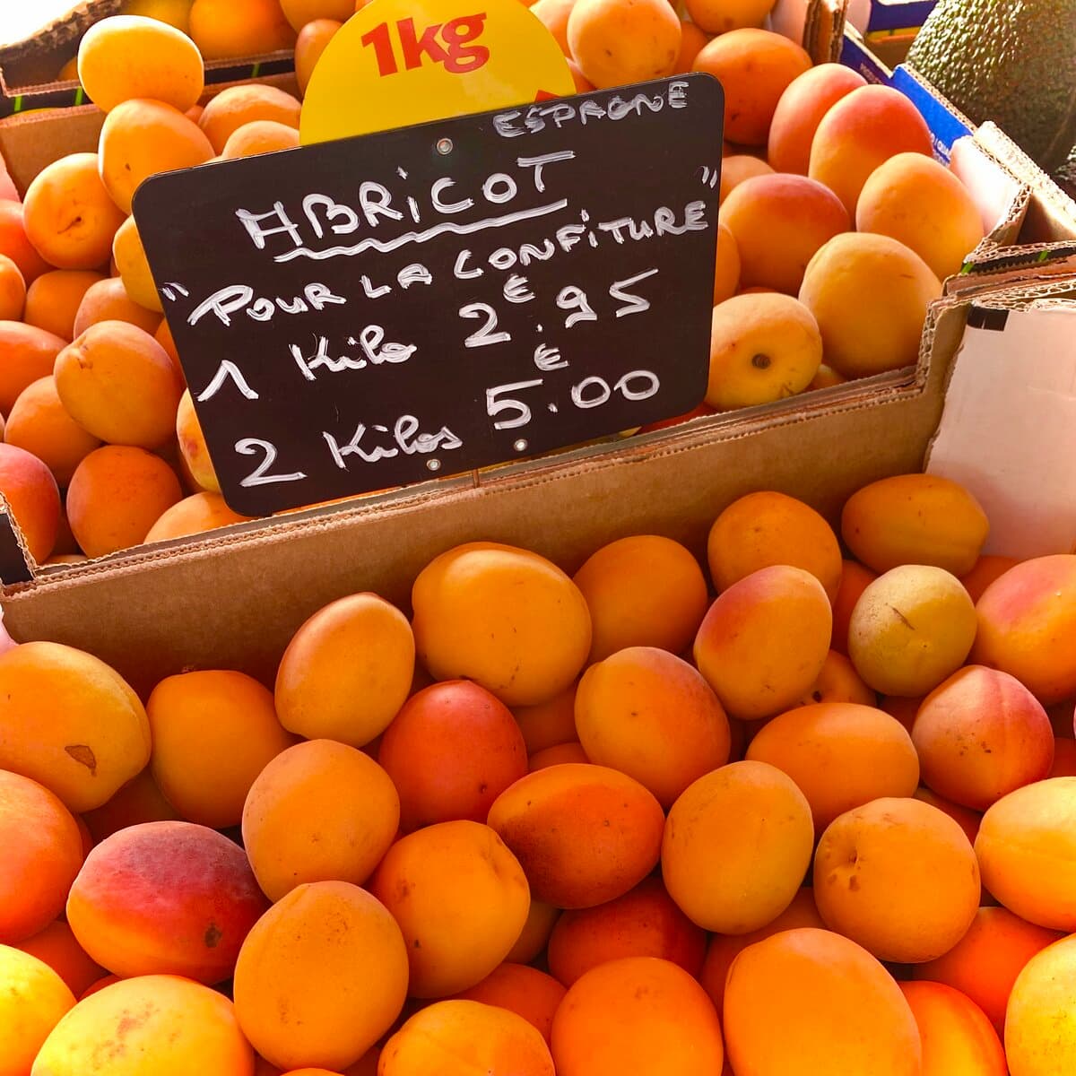 market-apricots-for-making-jam crates of fresh apricots